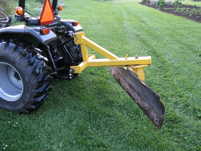 Where to find tractor w back blade in Seattle